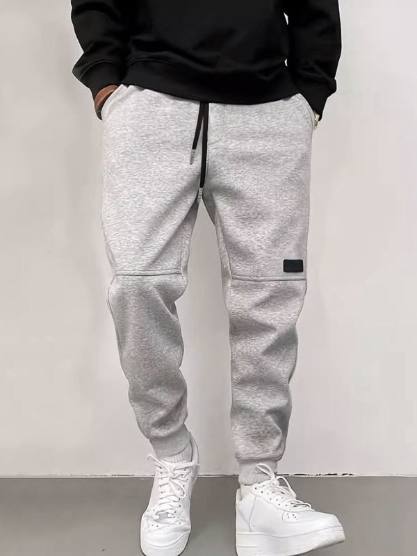 Men's new solid color casual cuff trousers